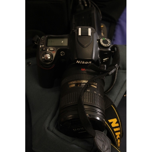 55 - Nikon D80 digital camera with lens and accessories, charging batteries, Sigma wide angle lens.