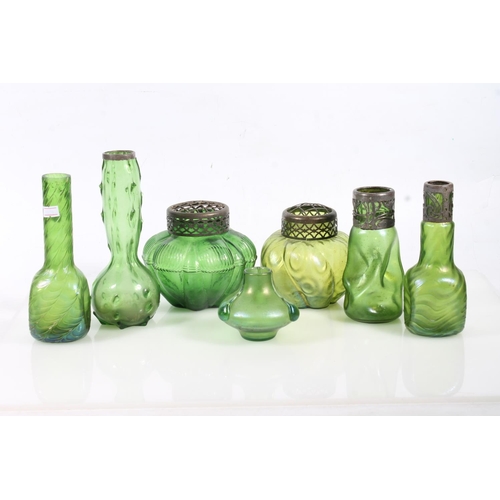 63 - Seven early 20th century Austrian Loetz iridescent glass vases.