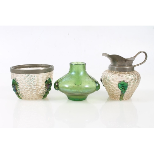 65 - Six early 20th century Austrian Loetz iridescent glass vases and jugs.