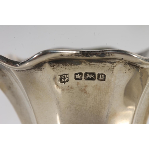 869 - Pair of sterling silver shaped spill vases, Thomas Bradbury & Son, Sheffield, 116g.