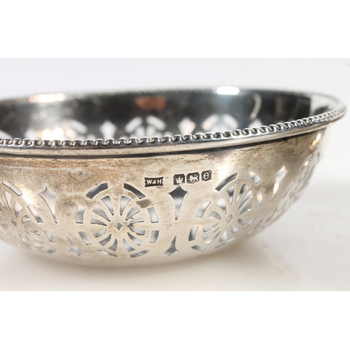 870 - Pair of sterling silver pierced bon-bon dishes or bowls, Walker & Hall, Sheffield, 76g.