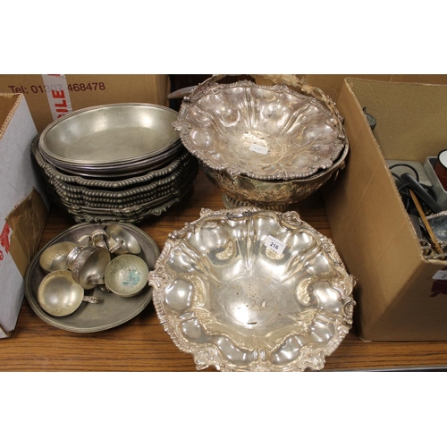 216 - Two silver-plated sing handled baskets, a silver-plated punch bowl and entree dishes.