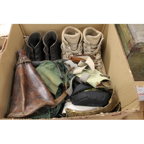 219 - Box containing army boots, a leather water carrier, a visor, chaps, etc.