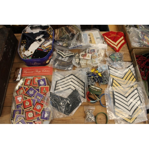 223 - British military insignia to include badges, epaulettes, chevrons, medal ribbons, etc., also cigaret... 