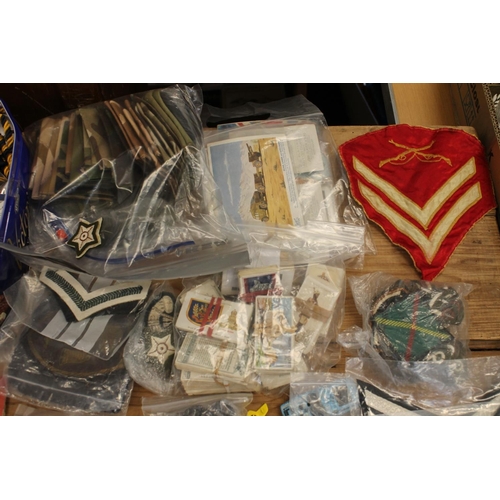 223 - British military insignia to include badges, epaulettes, chevrons, medal ribbons, etc., also cigaret... 