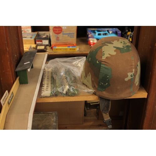 224 - British army helmet with label 'S.A.P.H.I. (PTY) LTD Rosslyn' label penned 'Jimmy', cloth camouflage... 