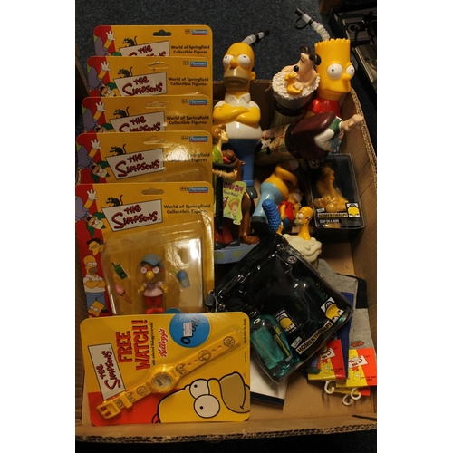 231 - The Simpsons related collectibles to include Playmates figurines carded, socks, bathtub accessories,... 