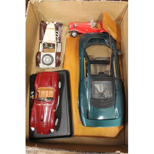 240 - Large scale model cars to include a 1958 Testarossa, a Burago Mercedes Benz, etc.