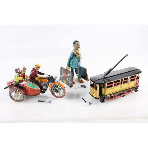 248 - Three clockwork tinplate style models to include a motorbike and sidecar, a gentleman with suitcase ... 