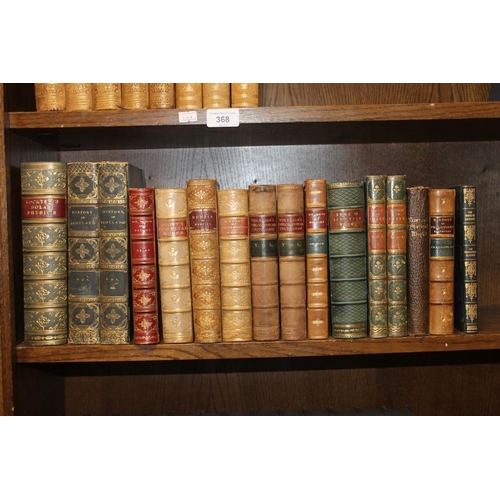 370 - Shelf containing leather bound books.