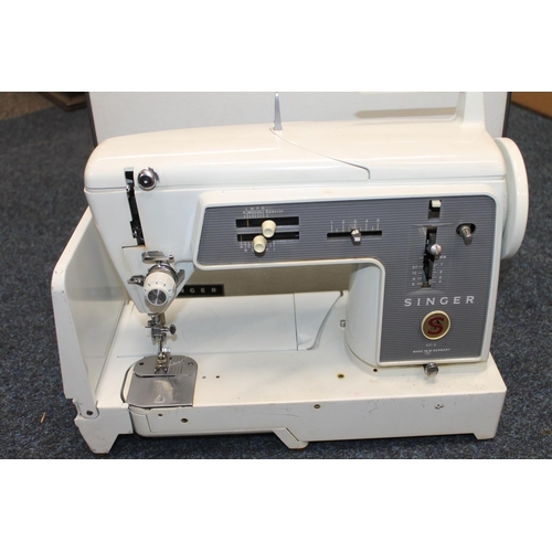 386 - Cased sewing machine.