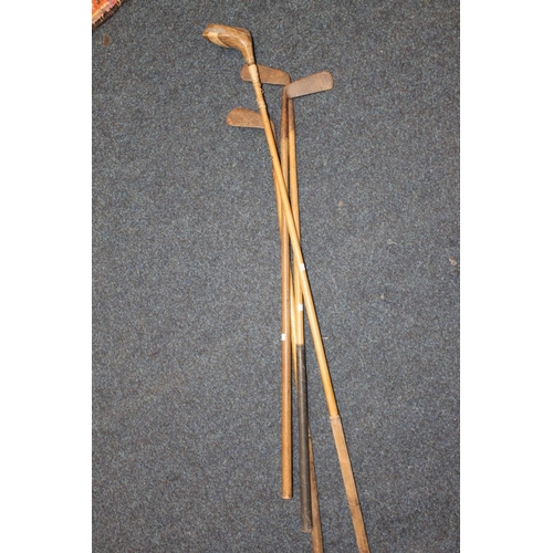 401 - Four hickory shafted golf clubs