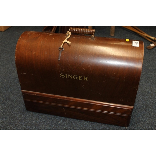 402 - Cased Singer sewing machine.