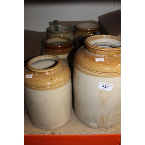 455 - Six stoneware crocks and two antique glass bottles.