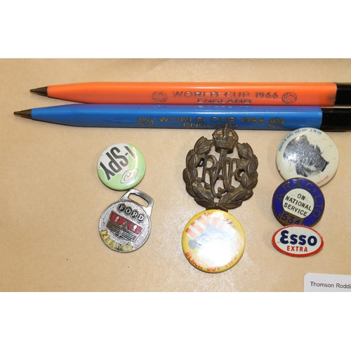 479 - Vintage badges to include Esso Extra, World Cup 1966 pens, etc.