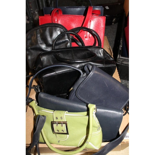 484 - Two boxes containing ladies handbags.