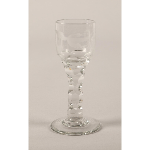 7 - Antique faceted stem wine glass with etched bird design, pontil mark to base, 14.5cm h