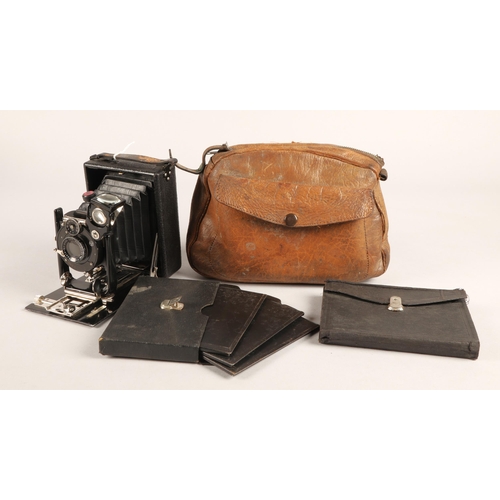 40 - Vintage folding camera in leather bag with  slides.