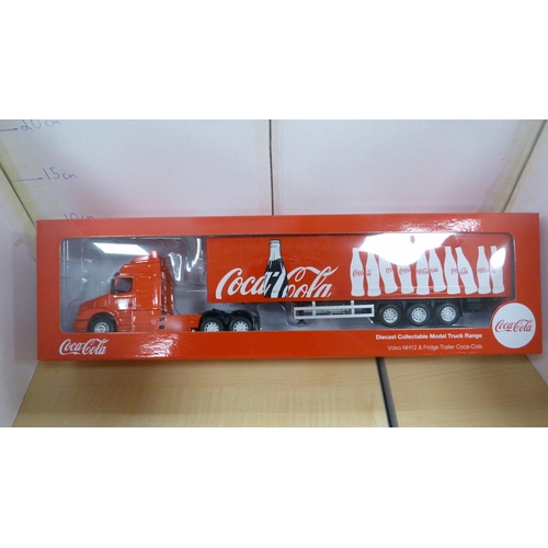 10 - Five boxed model vehicles including Coca-Cola truck, tipping truck etc.