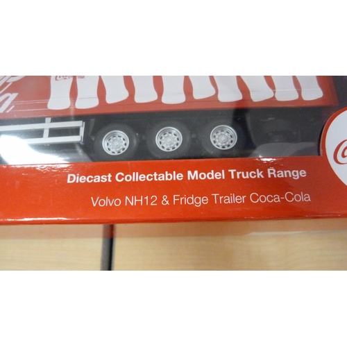 10 - Five boxed model vehicles including Coca-Cola truck, tipping truck etc.