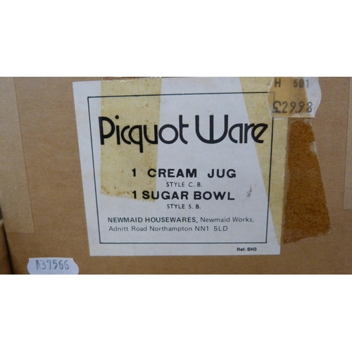 12 - Four-piece Picquot ware tea set, boxed.