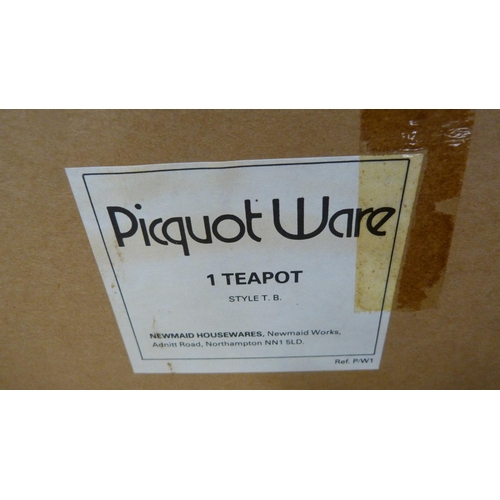 12 - Four-piece Picquot ware tea set, boxed.