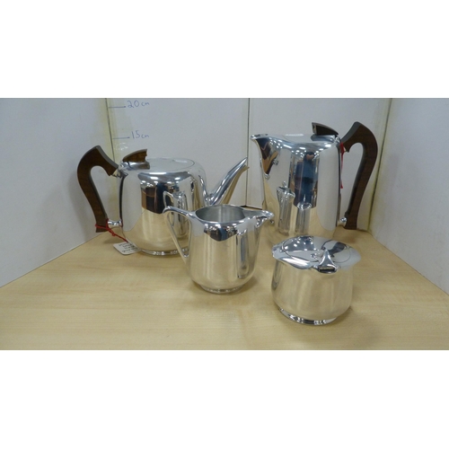 12 - Four-piece Picquot ware tea set, boxed.