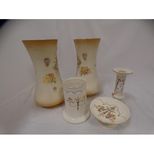 122 - Devon Fieldings floral decorated chamber set and a similar pair of vases.