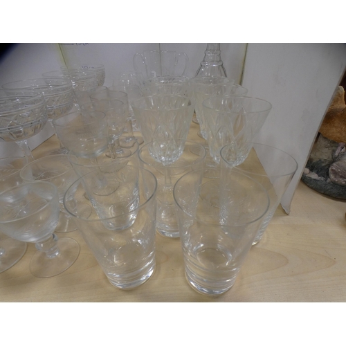 123 - Collection of glassware to include ER 1953 twin-handled goblet, decanter, drinking glasses etc.