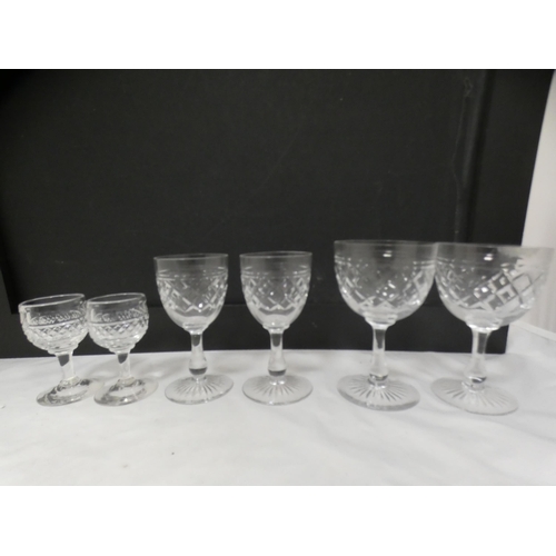 128 - Suite of various cut glass wine glasses and others.