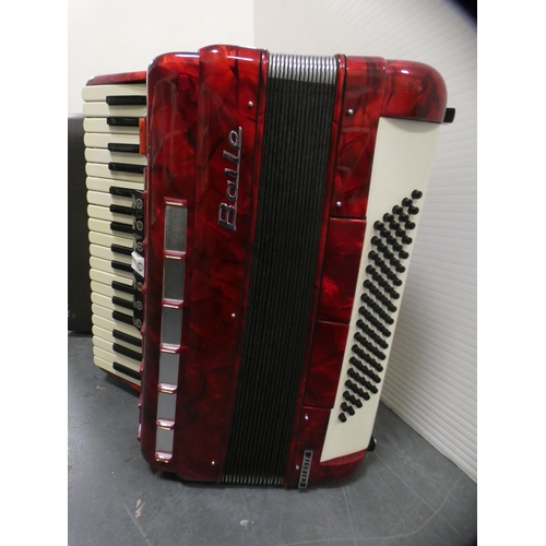 142 - Red lustre Baile Celeste accordion, cased.