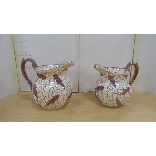 16 - Floral decorated two-piece chamber set, pair of Wedgwood purple lustre graduated jugs, and a Wedgwoo... 