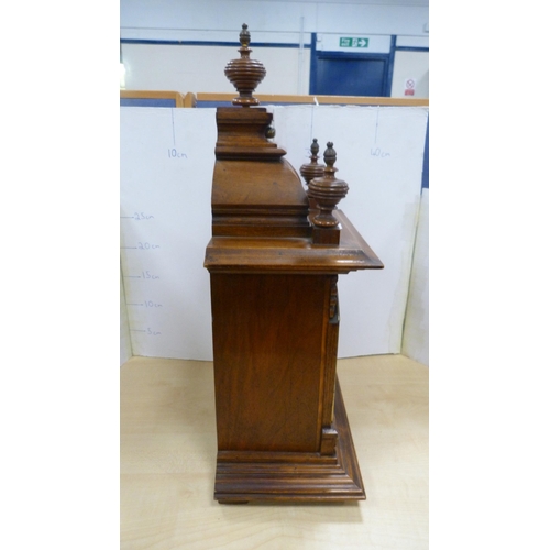 17 - Antique oak-cased mantel clock.