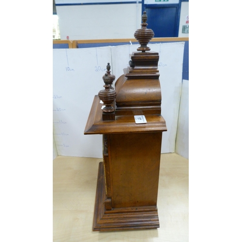 17 - Antique oak-cased mantel clock.