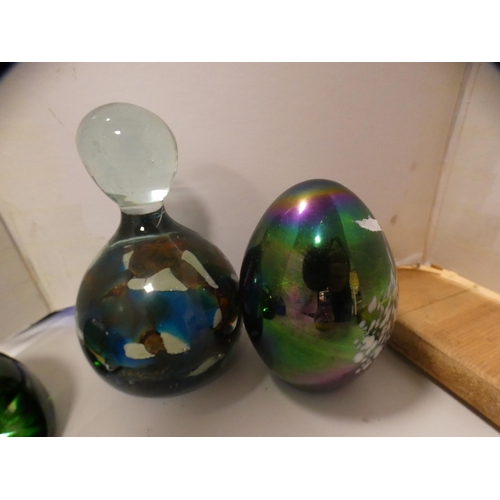 176 - Four pieces of blue coloured glass and five various paperweights to include Mdina.