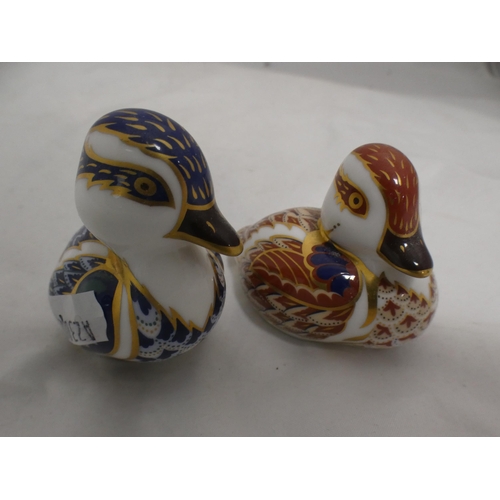 194 - Two Royal Crown Derby paperweights modelled as ducks, and a pin dish.  (3)