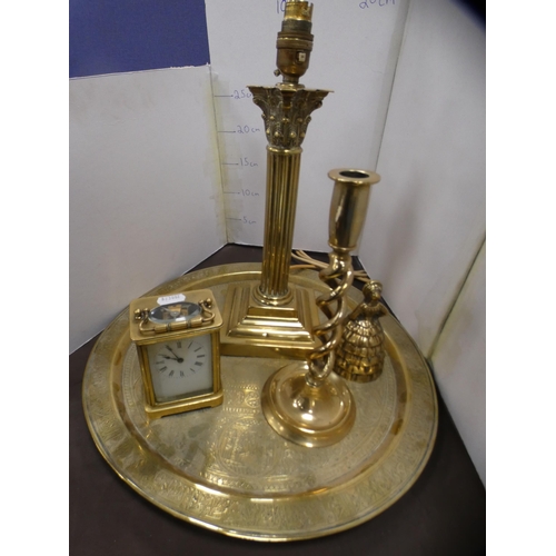 200 - Brass tray, carriage clock, candlestick, column table lamp and a bell.  (5)