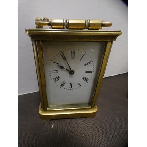 200 - Brass tray, carriage clock, candlestick, column table lamp and a bell.  (5)