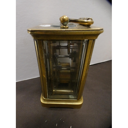 200 - Brass tray, carriage clock, candlestick, column table lamp and a bell.  (5)