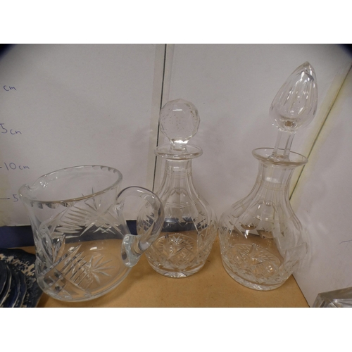 207A - Five assorted glass decanters and a jug.