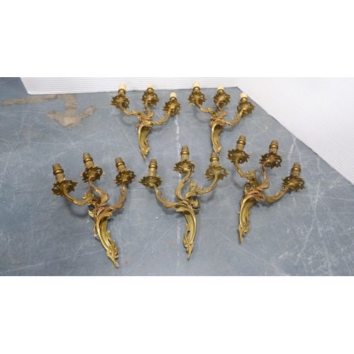 21 - Five gilded triple-branch wall sconces.