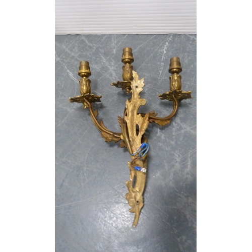 21 - Five gilded triple-branch wall sconces.