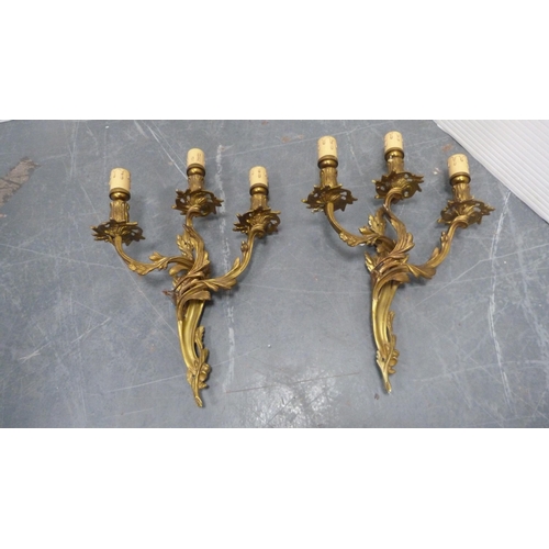 21 - Five gilded triple-branch wall sconces.