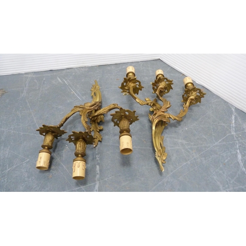 21 - Five gilded triple-branch wall sconces.