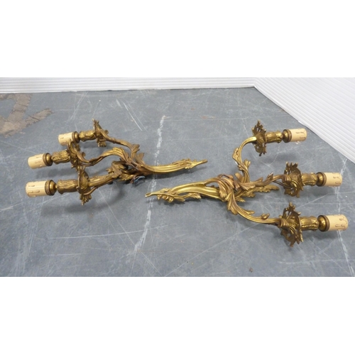 21 - Five gilded triple-branch wall sconces.