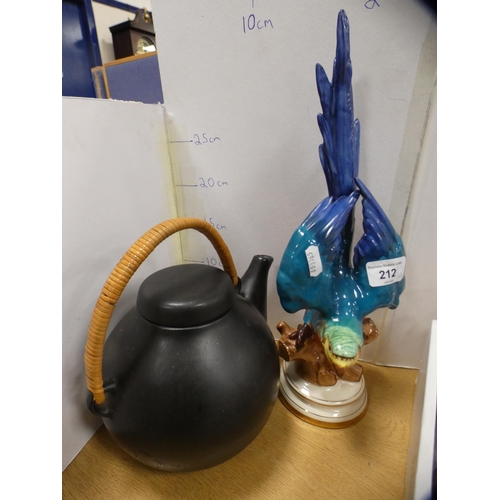 212 - Polychrome earthenware model of a parakeet and a teapot.