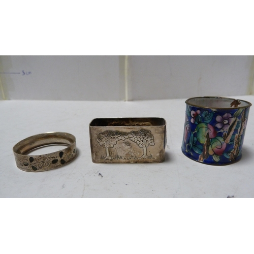 242 - Four silver napkin rings, another, enamelled, and various others.