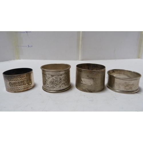 242 - Four silver napkin rings, another, enamelled, and various others.