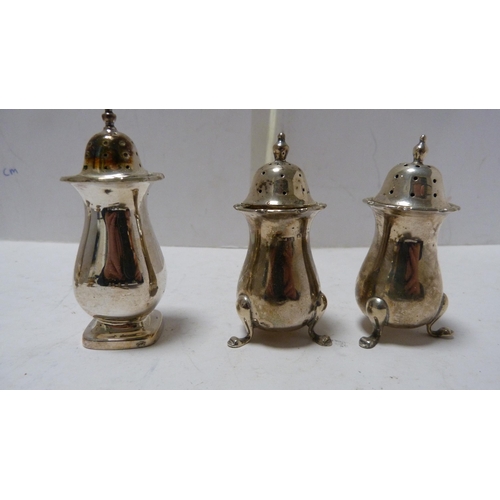 244 - Silver sugar caster, four silver thimbles and a four-piece EP condiment set.