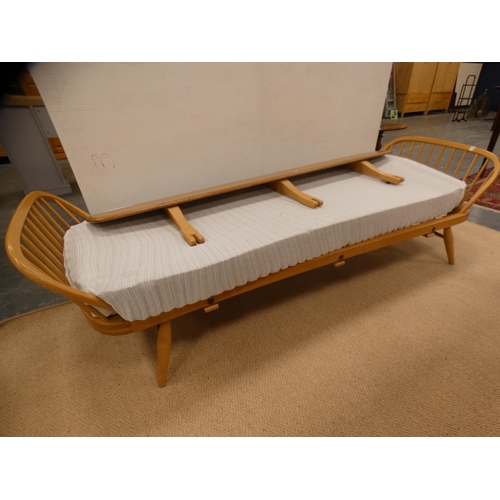 310 - Ercol blonde studio day bed.